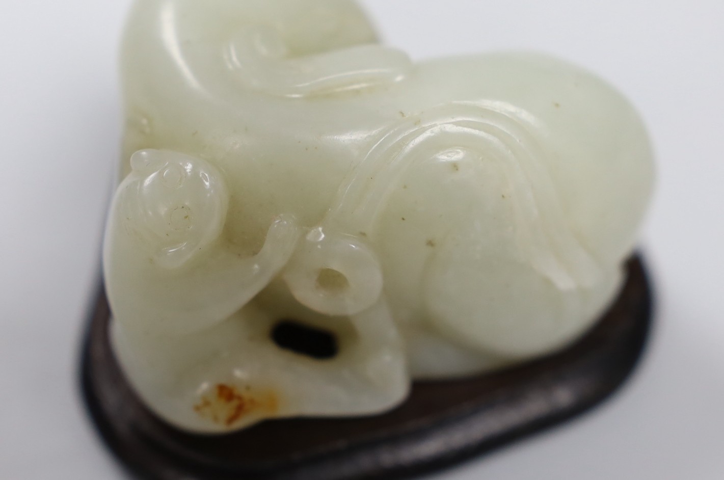 Chinese white jade carving of a monkey and elephant, with wooden stand - 8cms wide and a Chinese bronze figure